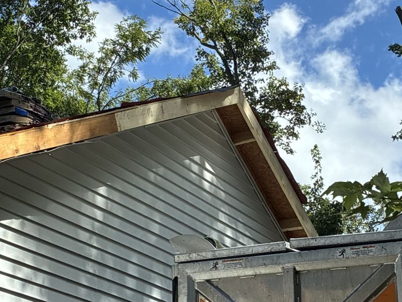 New vinyl siding on a gable end